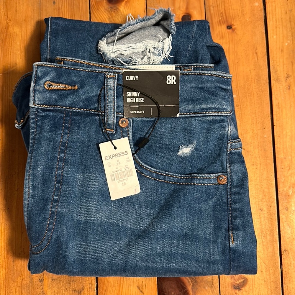 NWT Express Jeans.  8 regular curvy. Never worn.